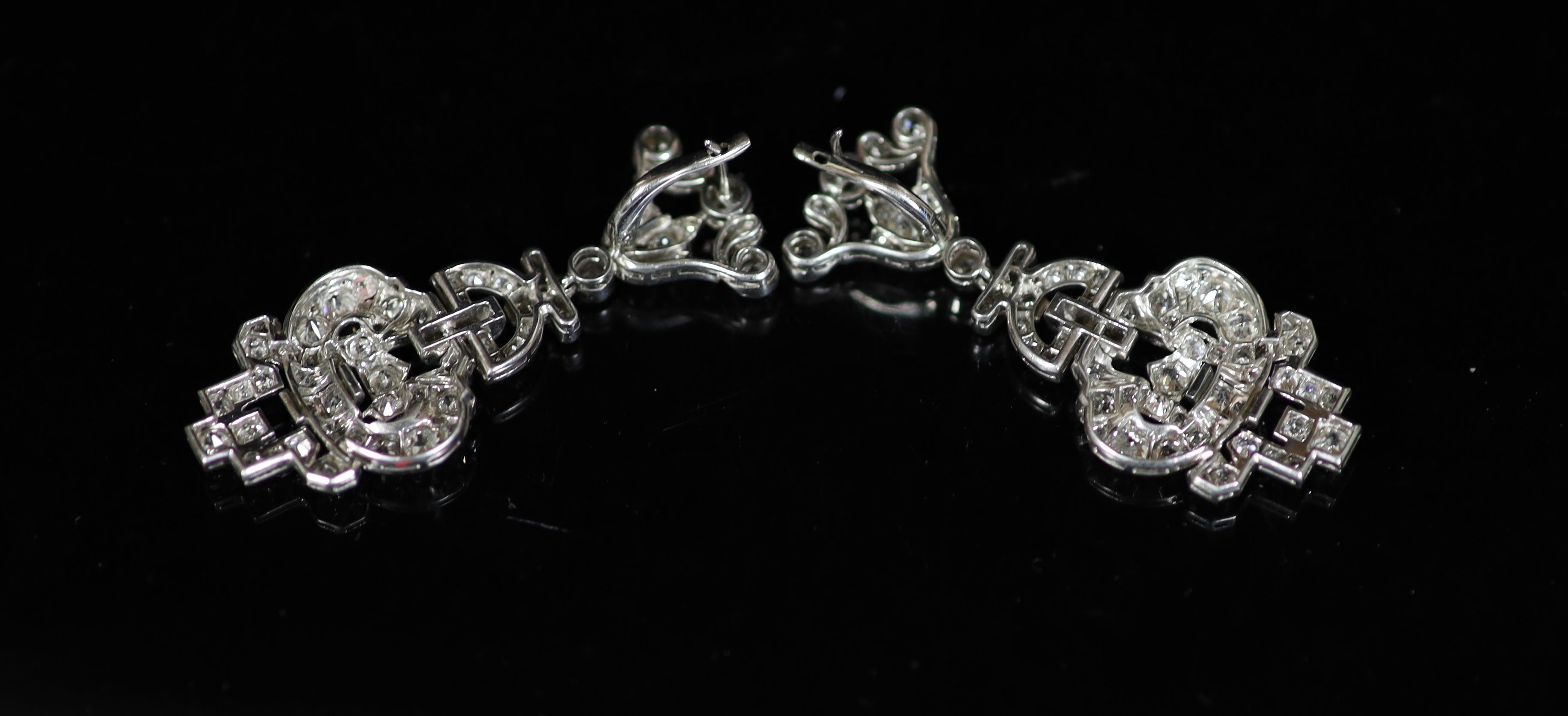 A cased pair of Victorian pierced platinum and old round cut diamond cluster set drop earrings